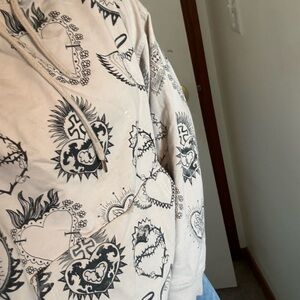 Hoodie with heart and cross design